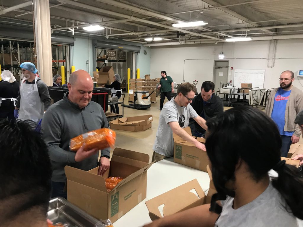 Barcodes Volunteers at the Greater Chicago Food Depository sorting and packaging bread.