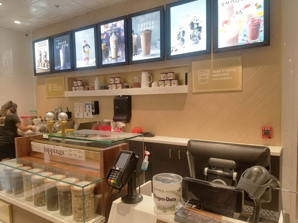 Airtrack S2 2D barcode scanner at Haagen Dazs checkout counter to improve scanning process.